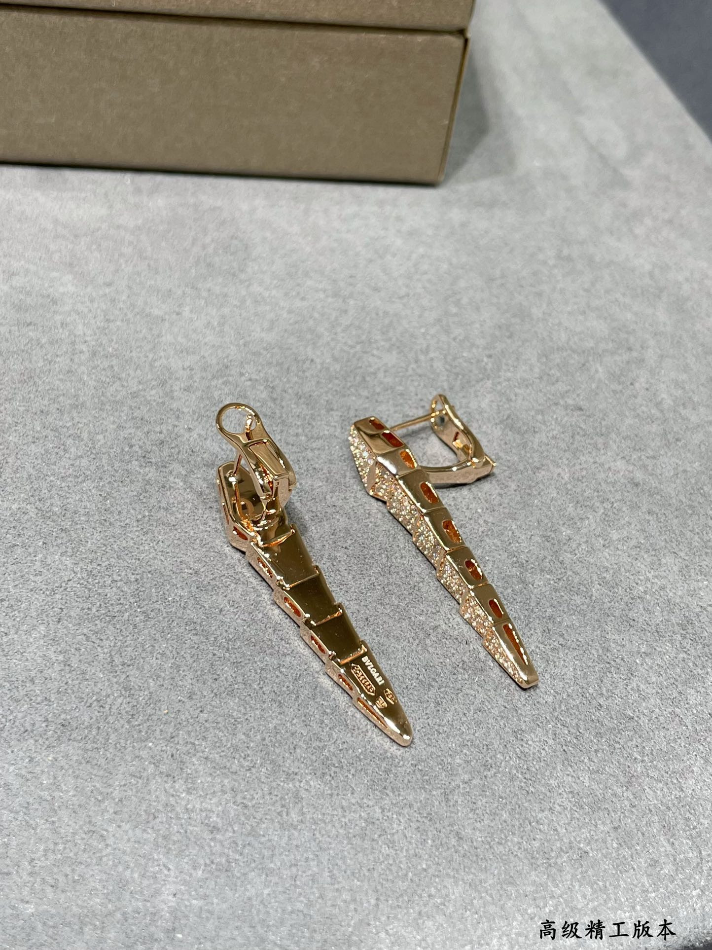 B*l*ai full-level drill snake earrings