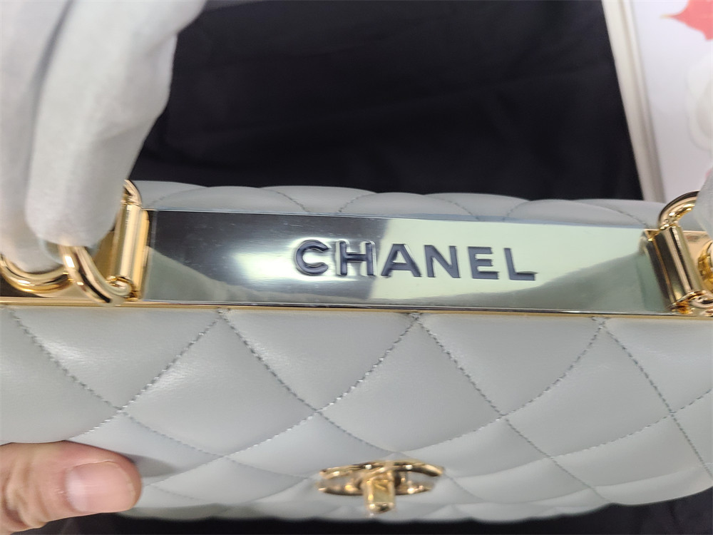Ch*el flap bag with top handle 6.6 × 9.8 × 4.7 in
