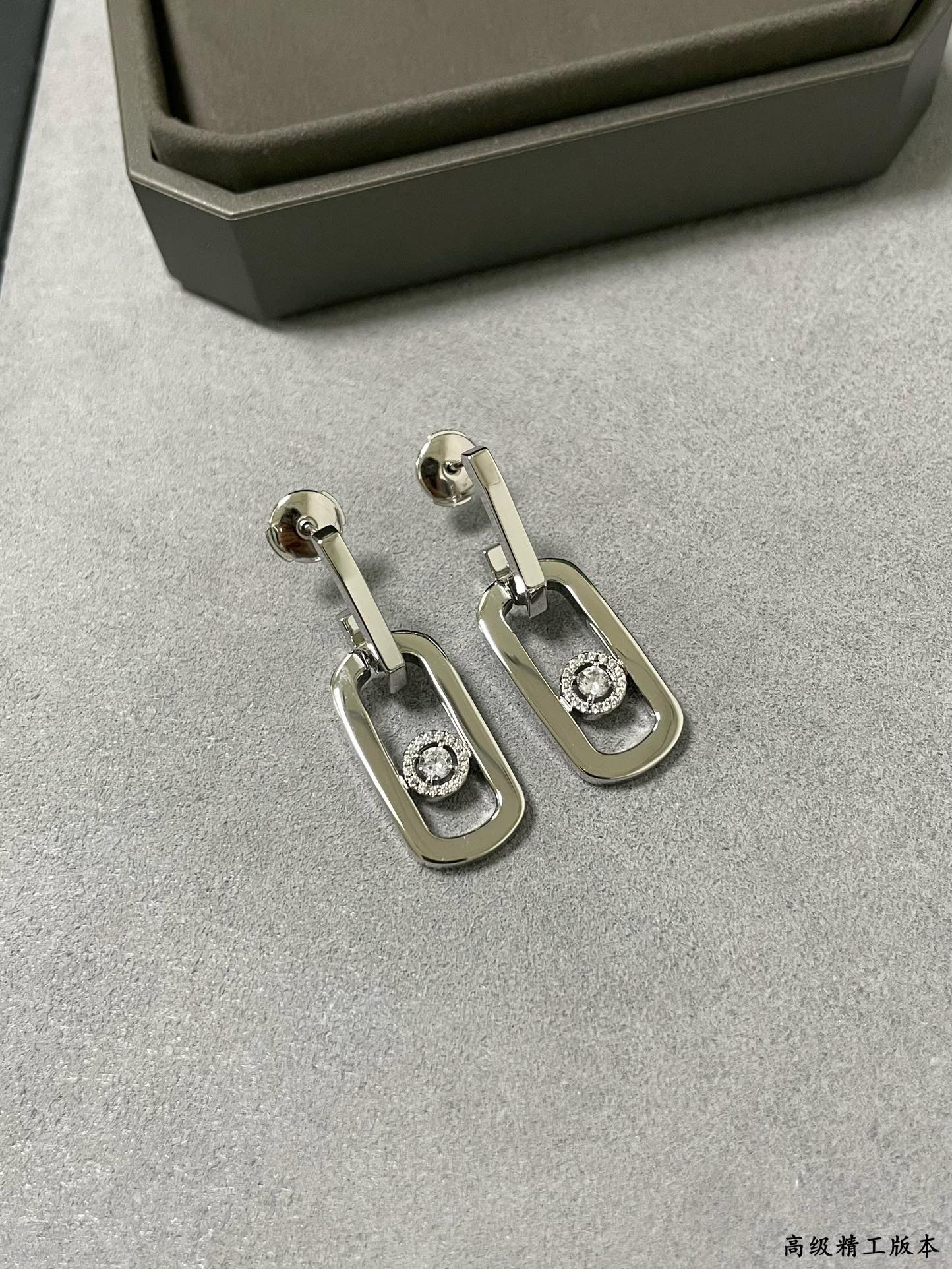 messika large single Di*m*nd moving stud earrings
