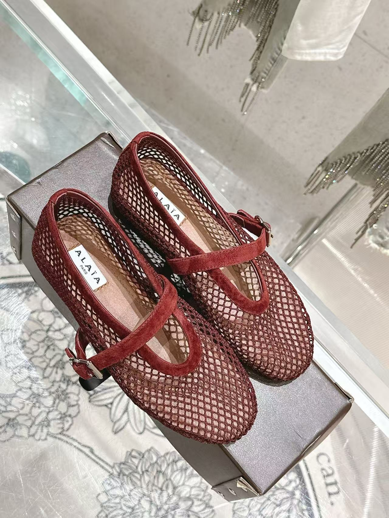 UA ALAÏA BALLET FLATS IN FISHNET