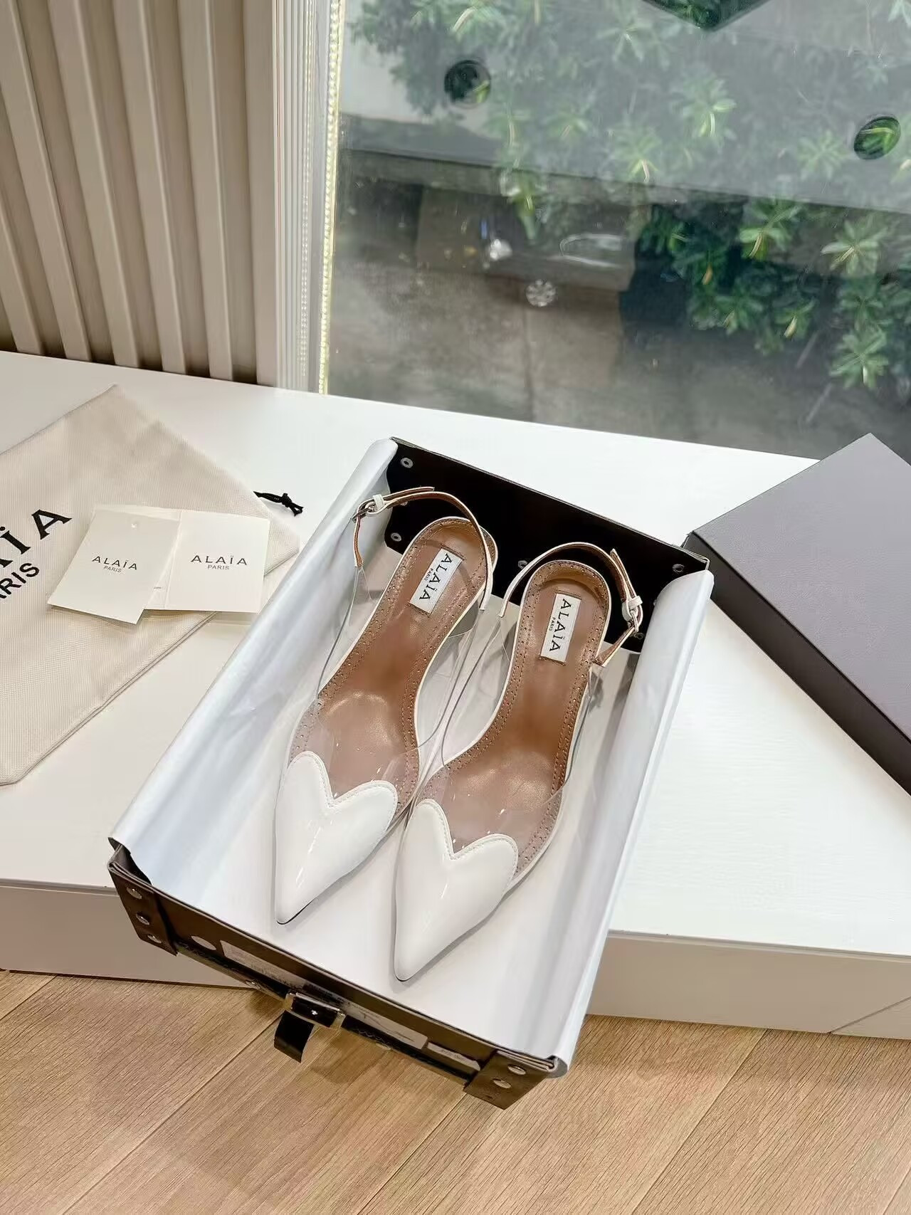 UA ALAÏA Le Coeur Plexi Heart-Toe Slingback Pump