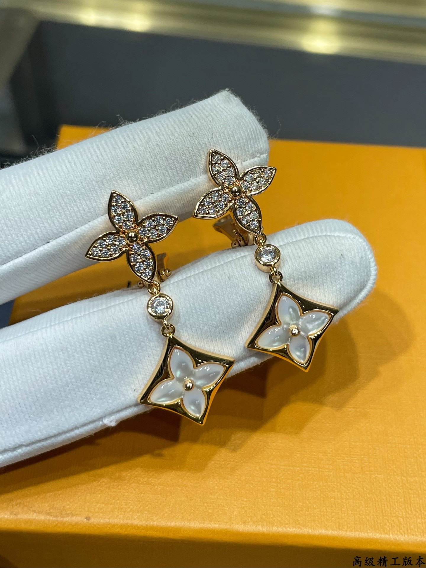 lv two flower Di*m*nd white shell earrings