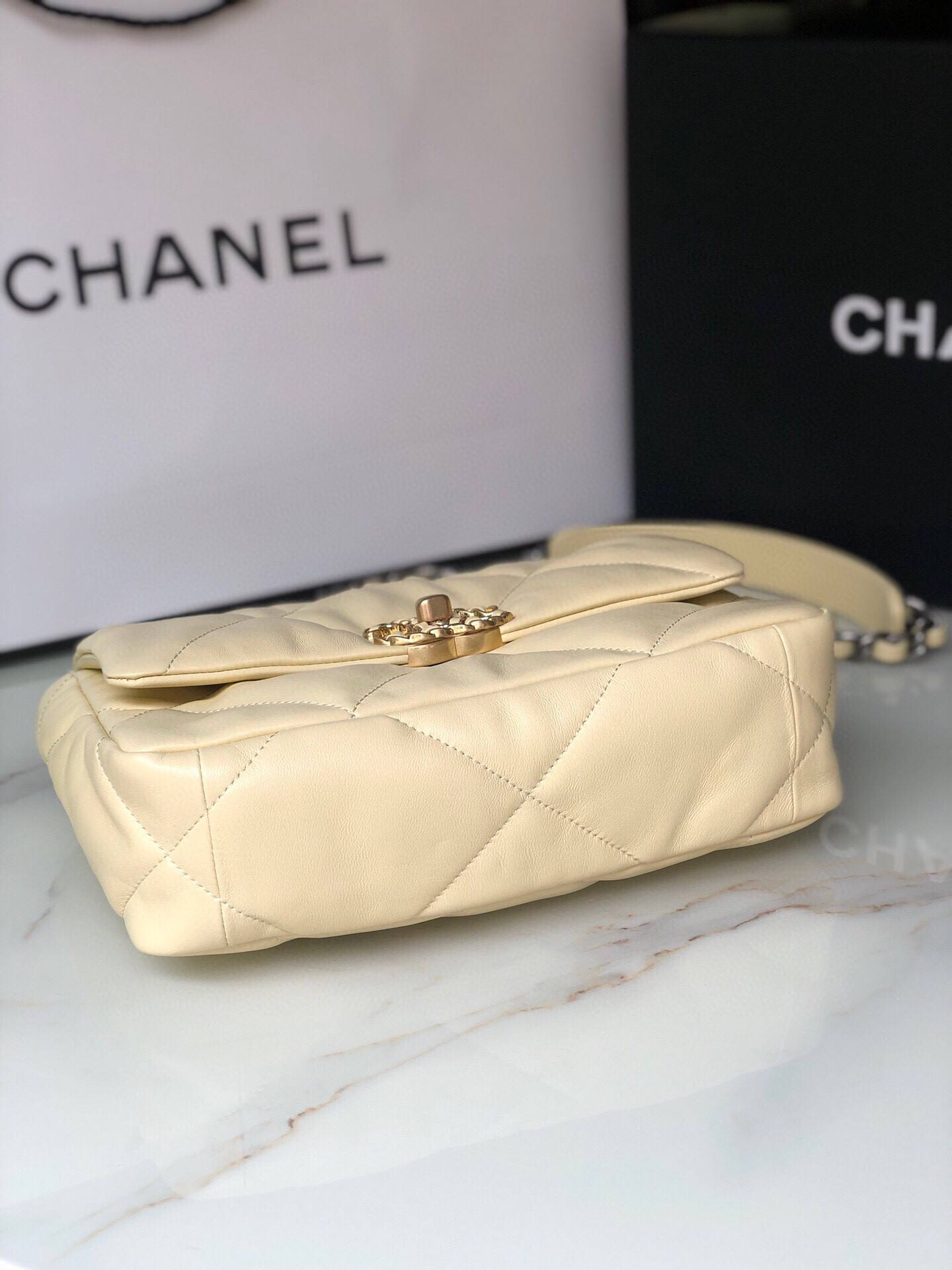 Ch*el 19 handbag shiny leather, gold-tone, silver-tone & ruthenium-finish metal dark yellow 6.2 × 10.1 × 3.5 in