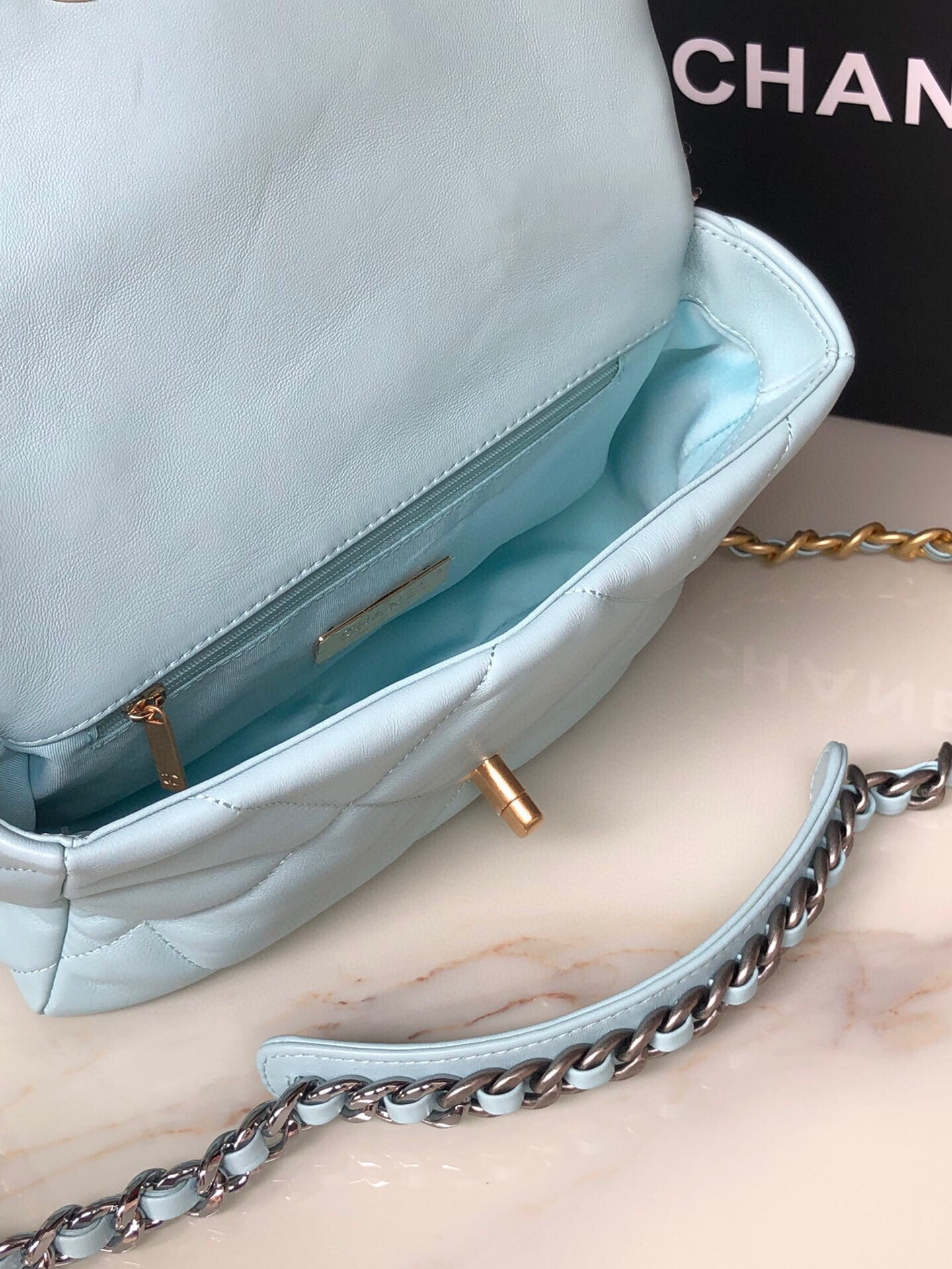 Ch*el 19 handbag shiny leather, gold-tone, silver-tone & ruthenium-finish metal light blue 6.2 × 10.1 × 3.5 in