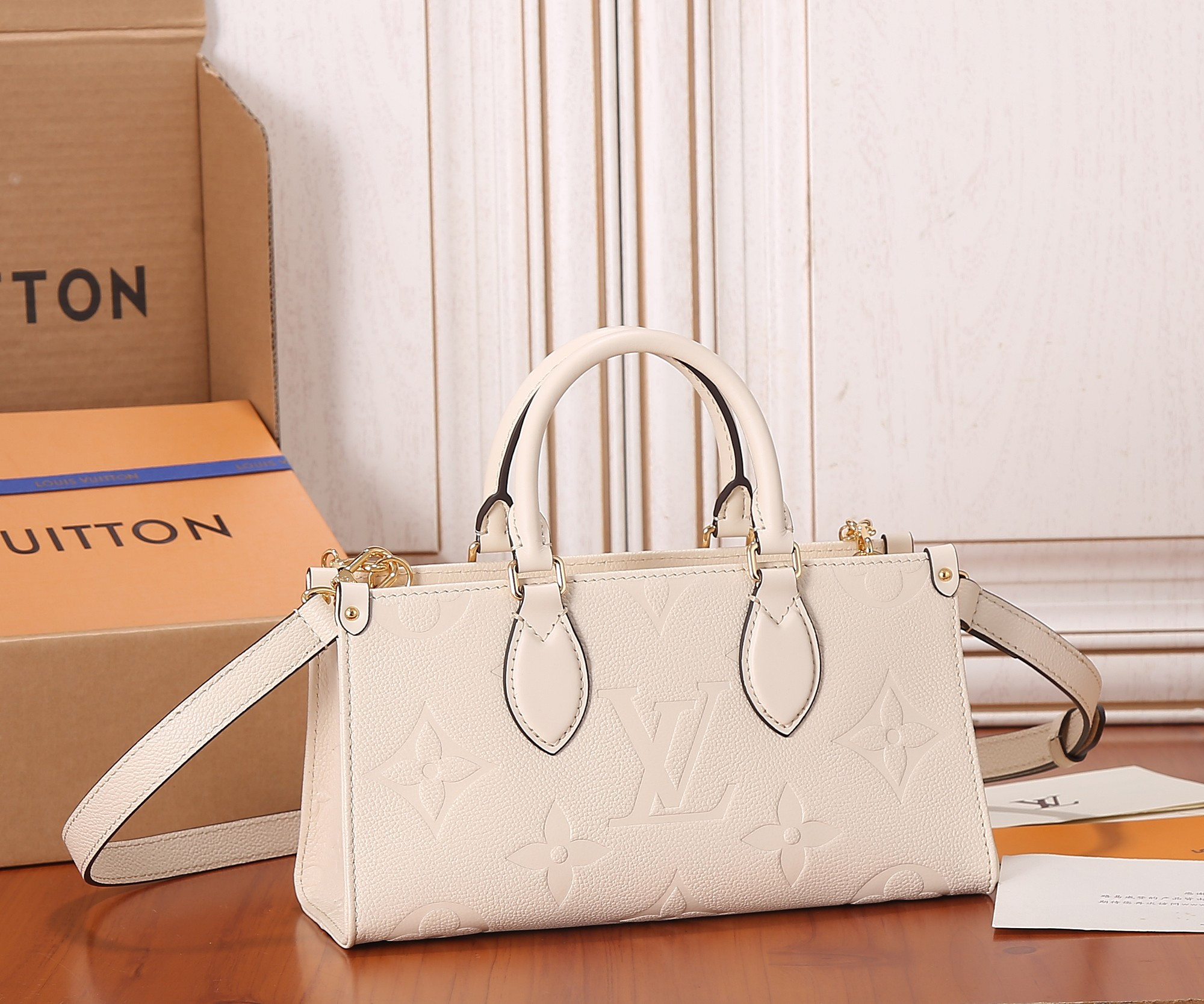 LV OnTheGo East West M23698 9.8 x 5.1 x 3.9 inches