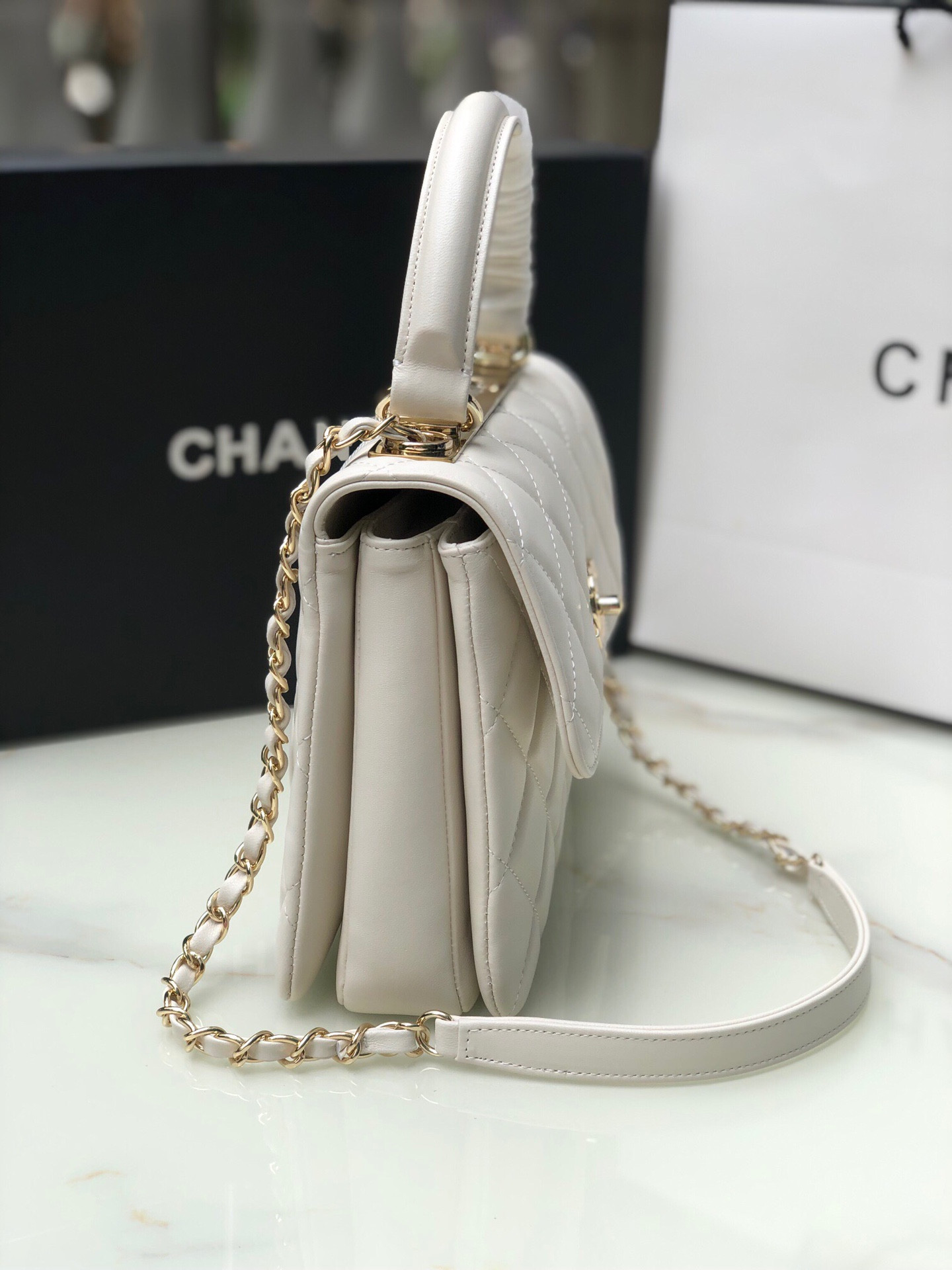 Ch*el flap bag with top handle 6.6 × 9.8 × 4.7 in