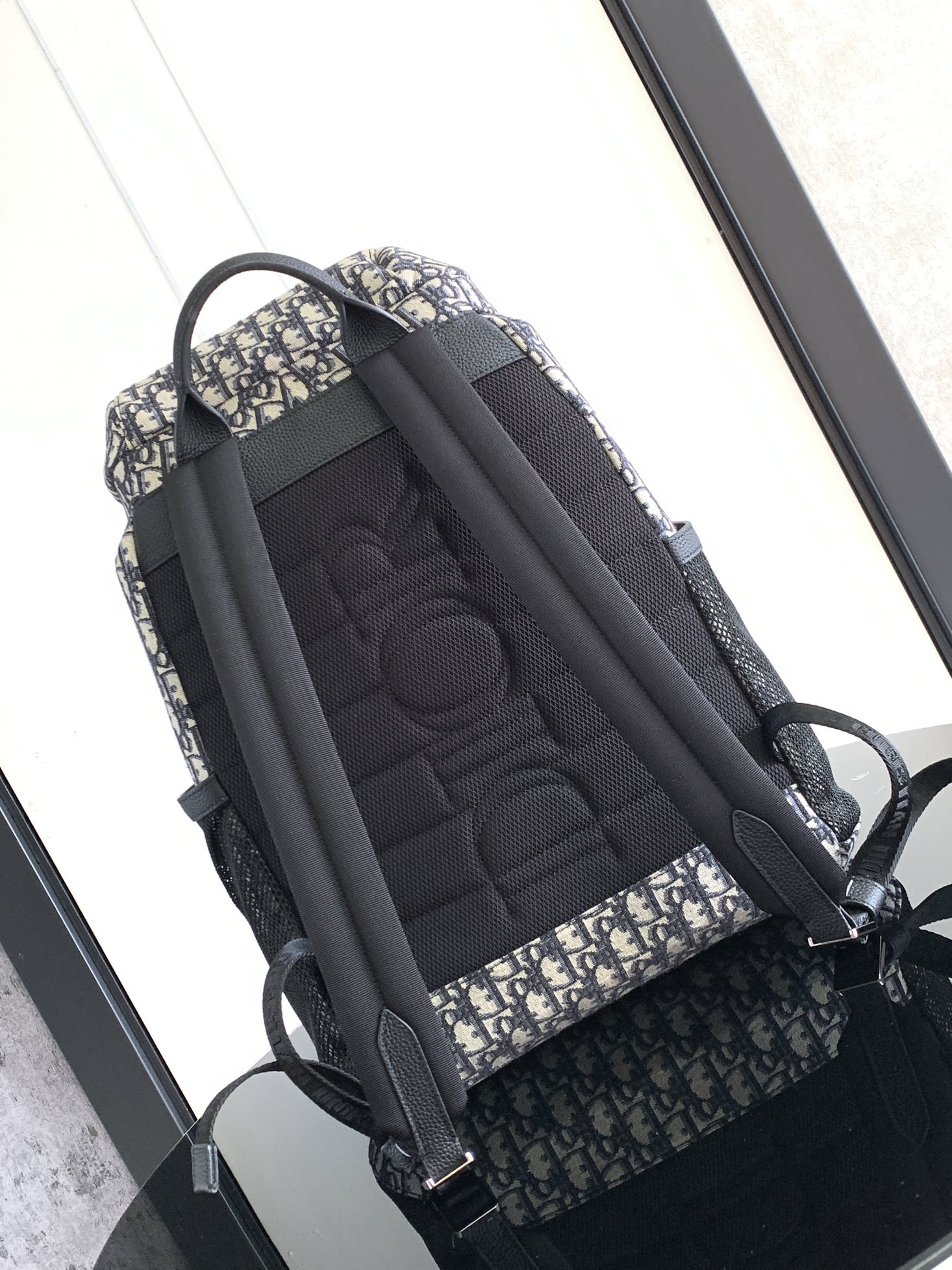 D*or 8 backpack with flap beige and black D*or oblique jacquard 31 x 48 x 16.5 cm