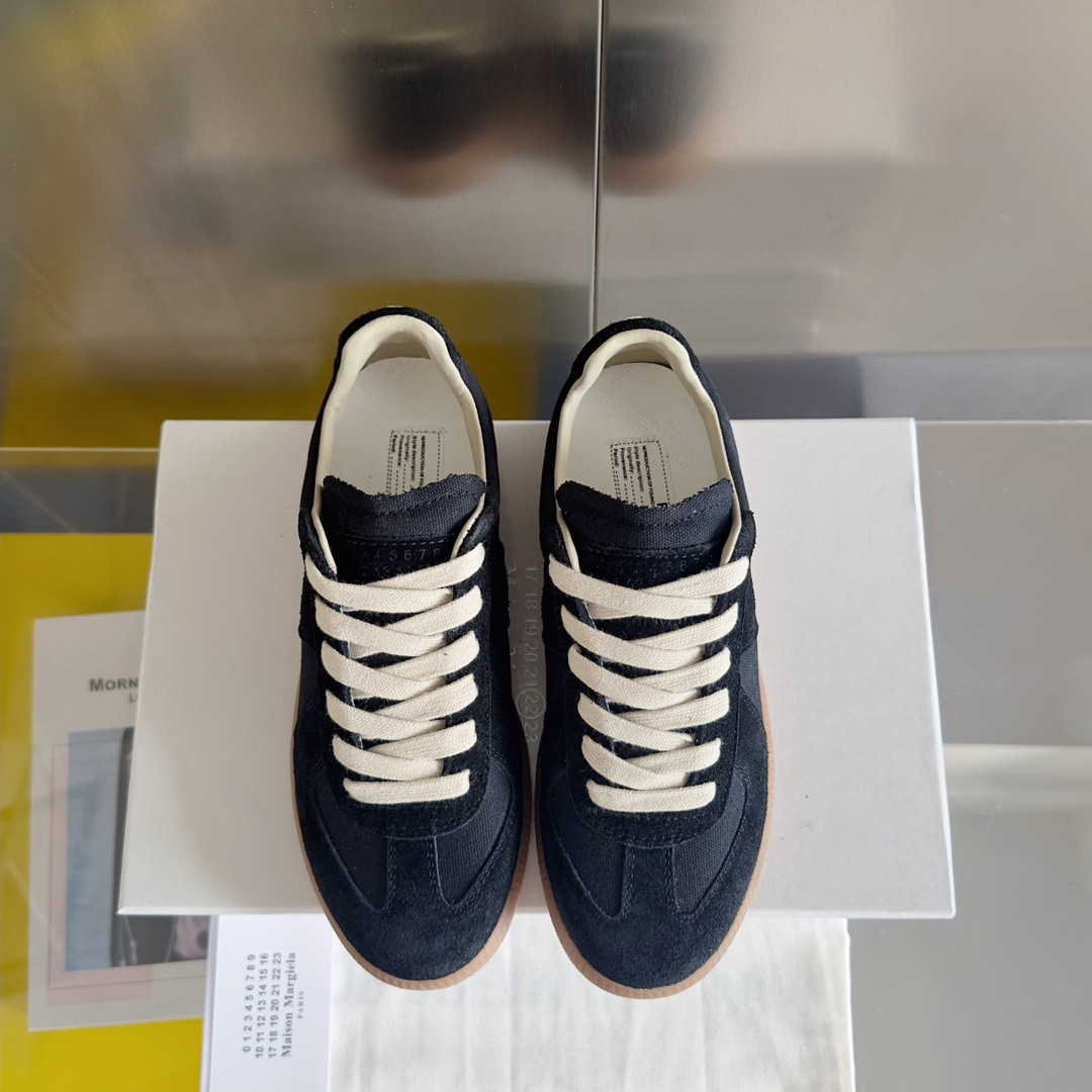 ua ma*s*n Ma*i*la mm6 sneakers