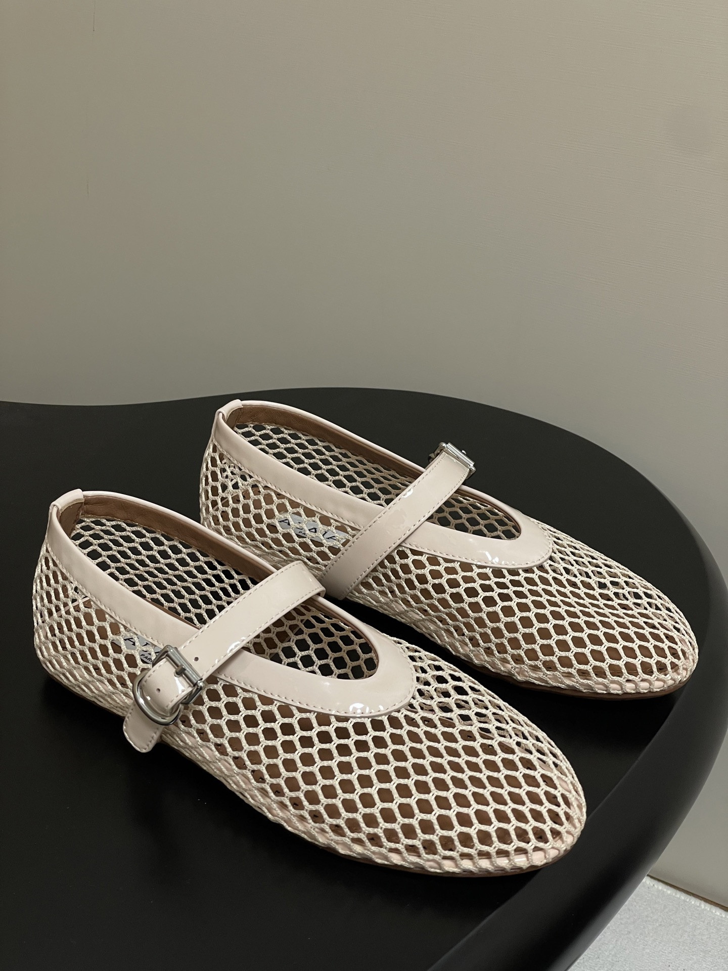 UA ALAÏA BALLET FLATS IN FISHNET