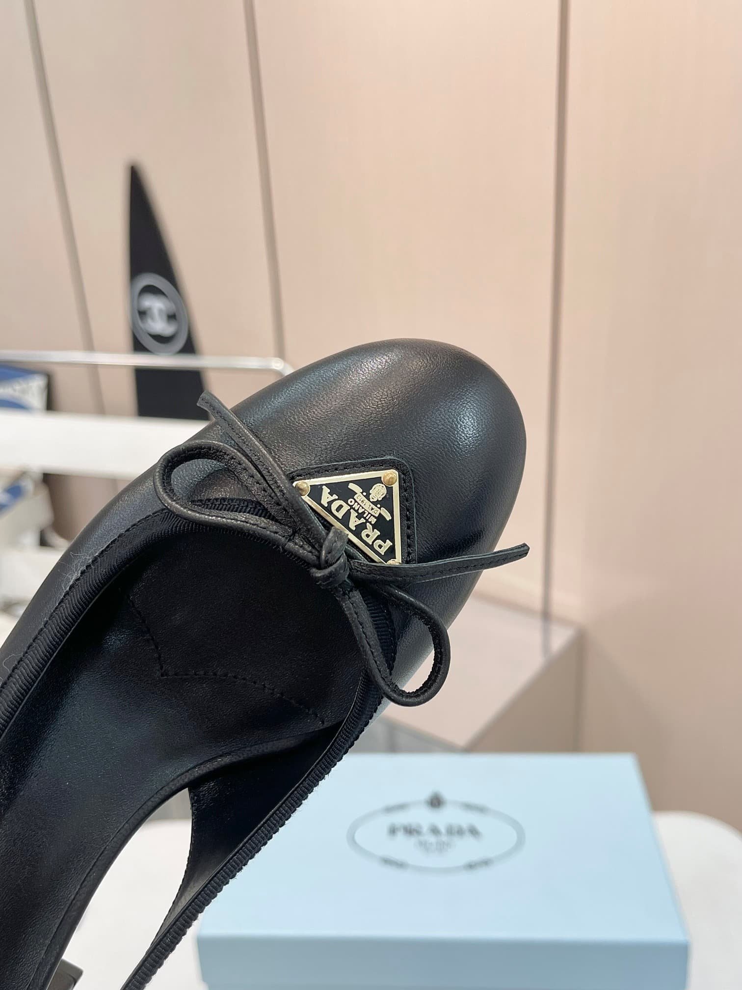 Pra*a Triangle Logo Bow Slingback Pump In Black