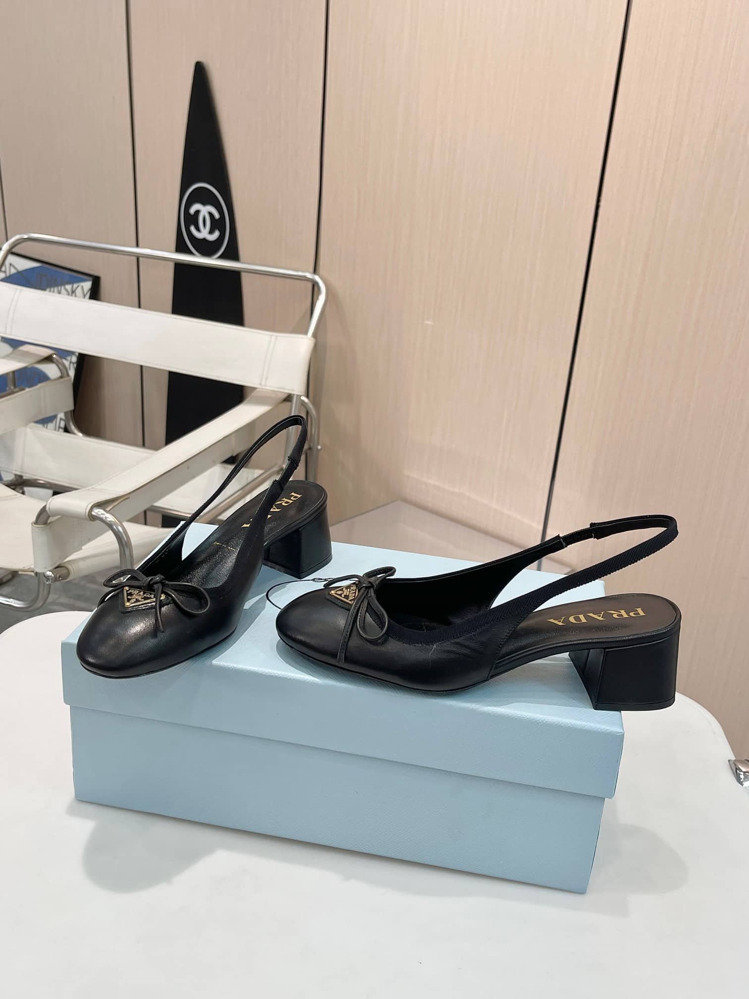 Pra*a Triangle Logo Bow Slingback Pump In Black