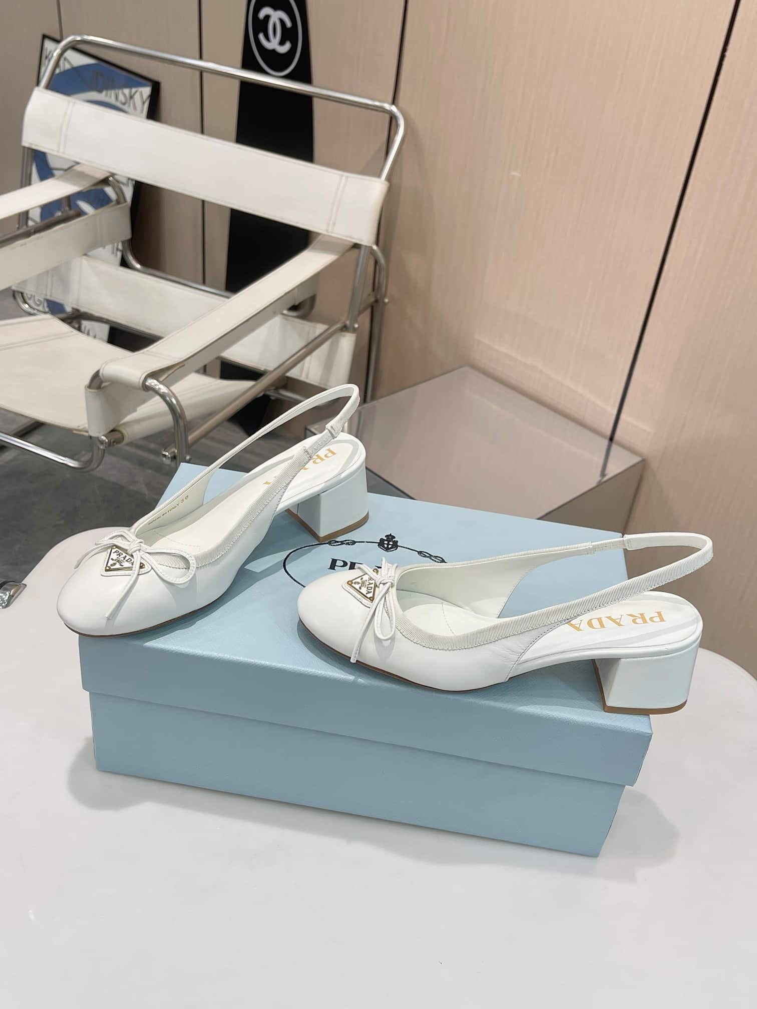 Pra*a Triangle Logo Bow Slingback Pump In White