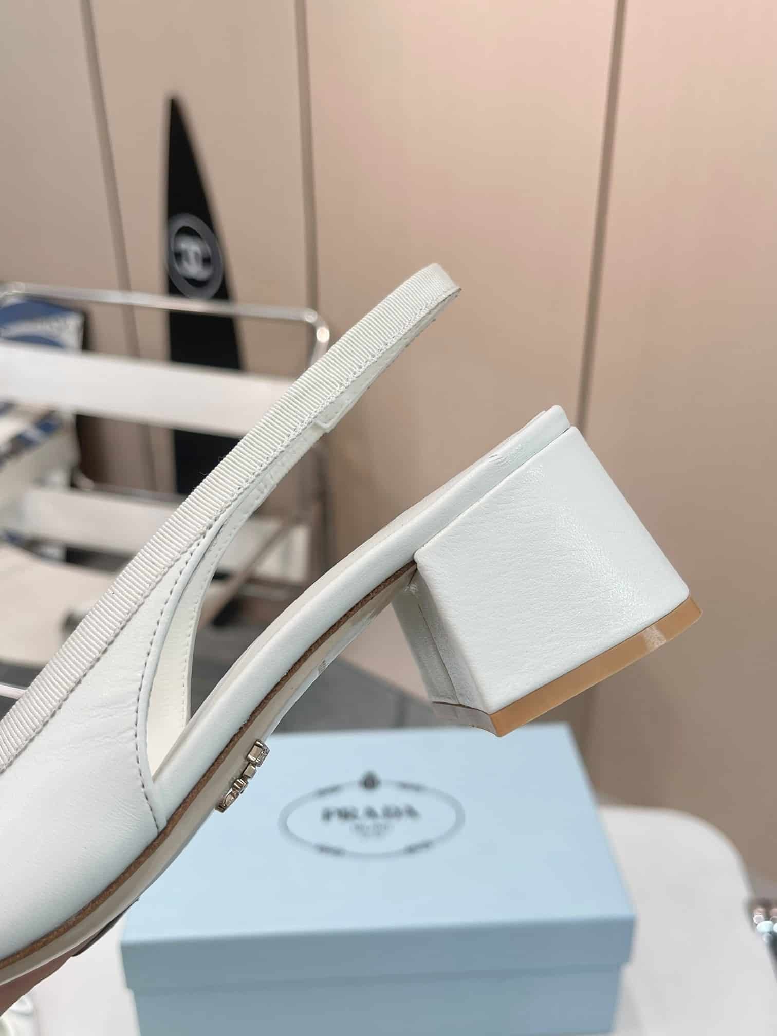 Pra*a Triangle Logo Bow Slingback Pump In White