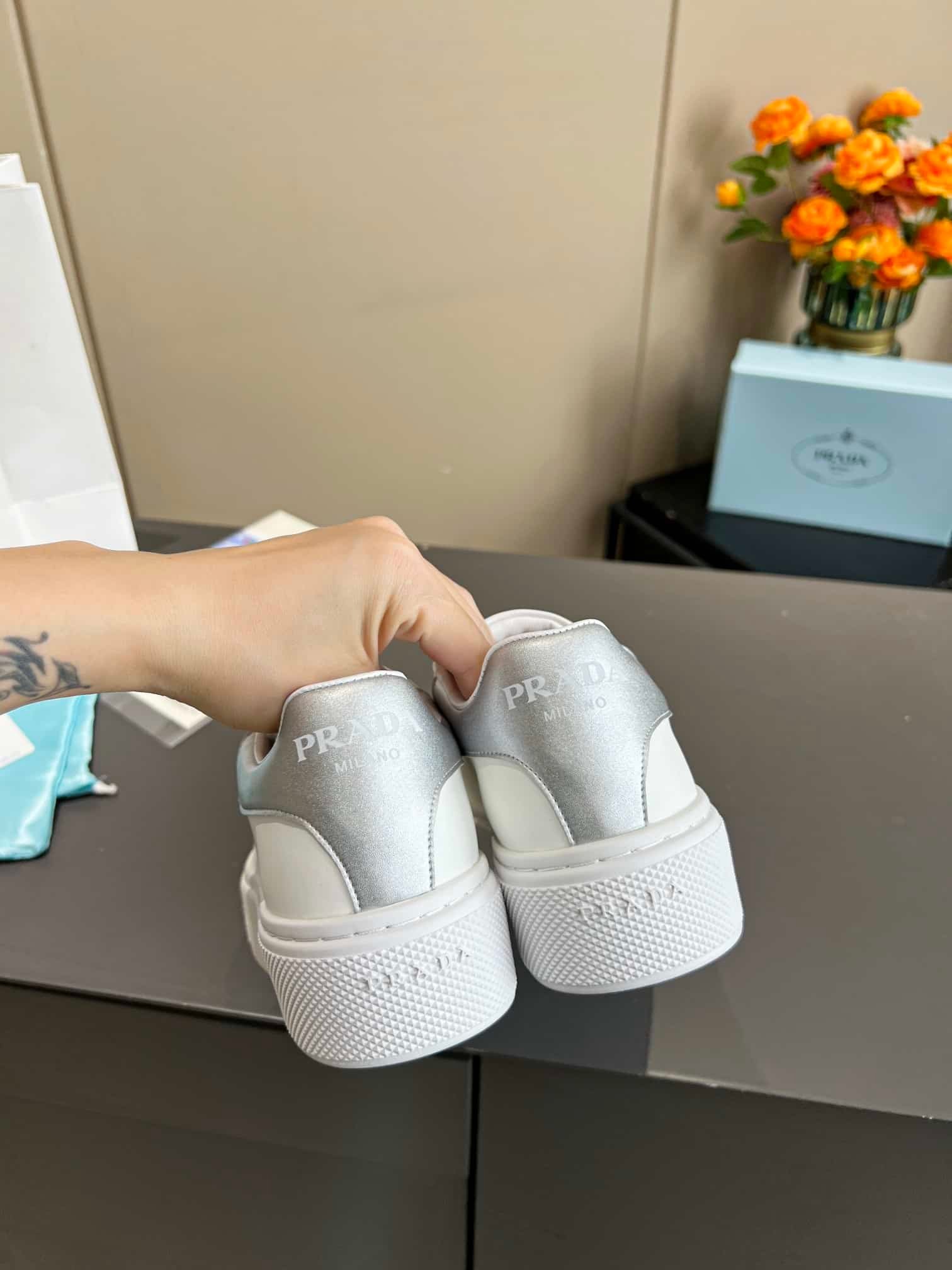 Pra*a Sneaker In White Leather With Silver Logo