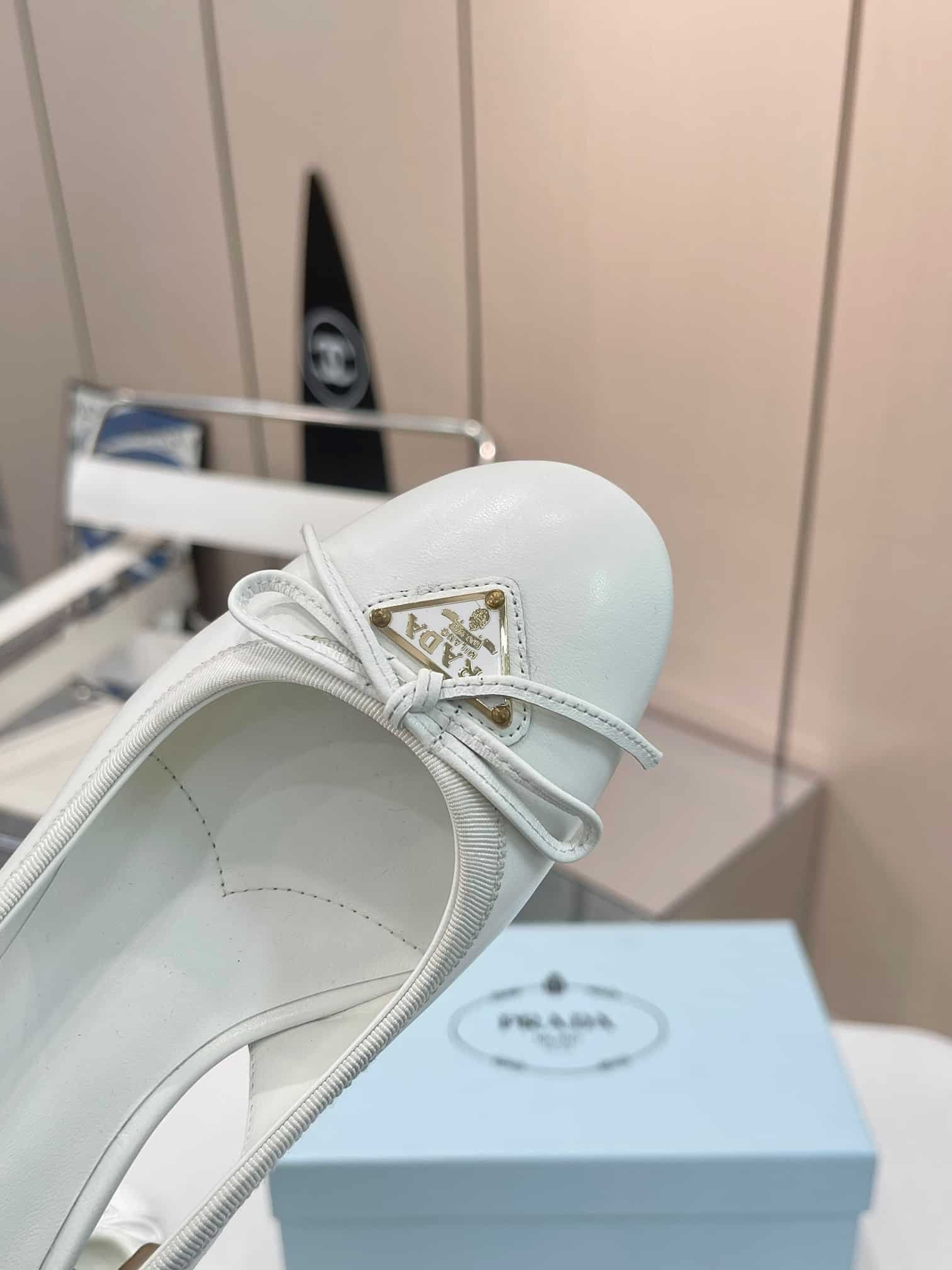 Pra*a Triangle Logo Bow Slingback Pump In White