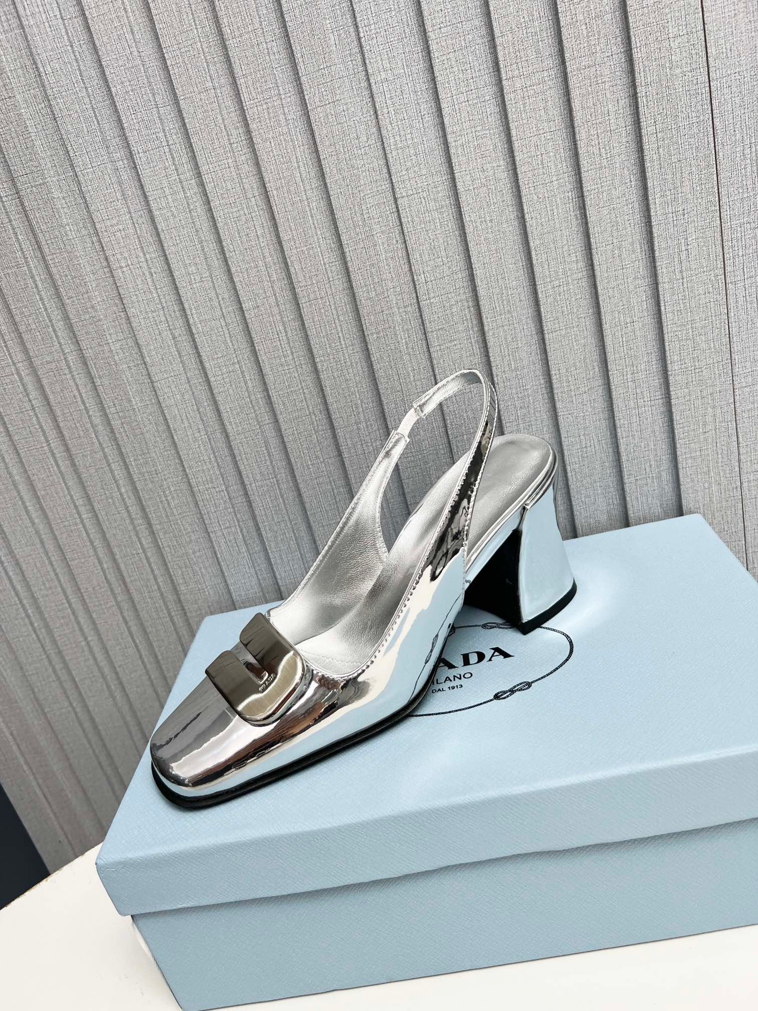 Pra*a Leather Slingback Pumps Silver