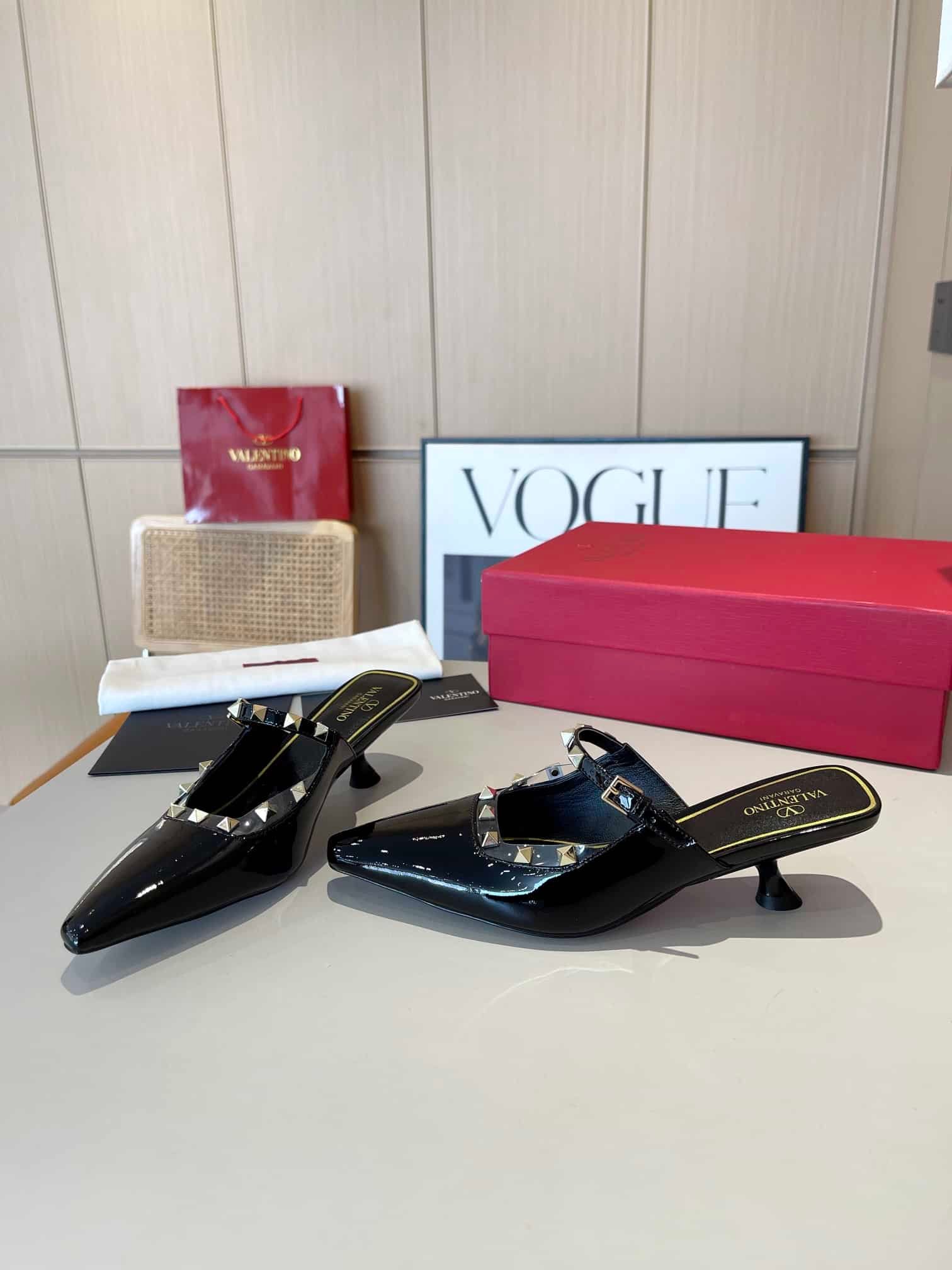 Va1e*ntin0 Garavani Rockstud Asymmetric Patent Leather Mules Black